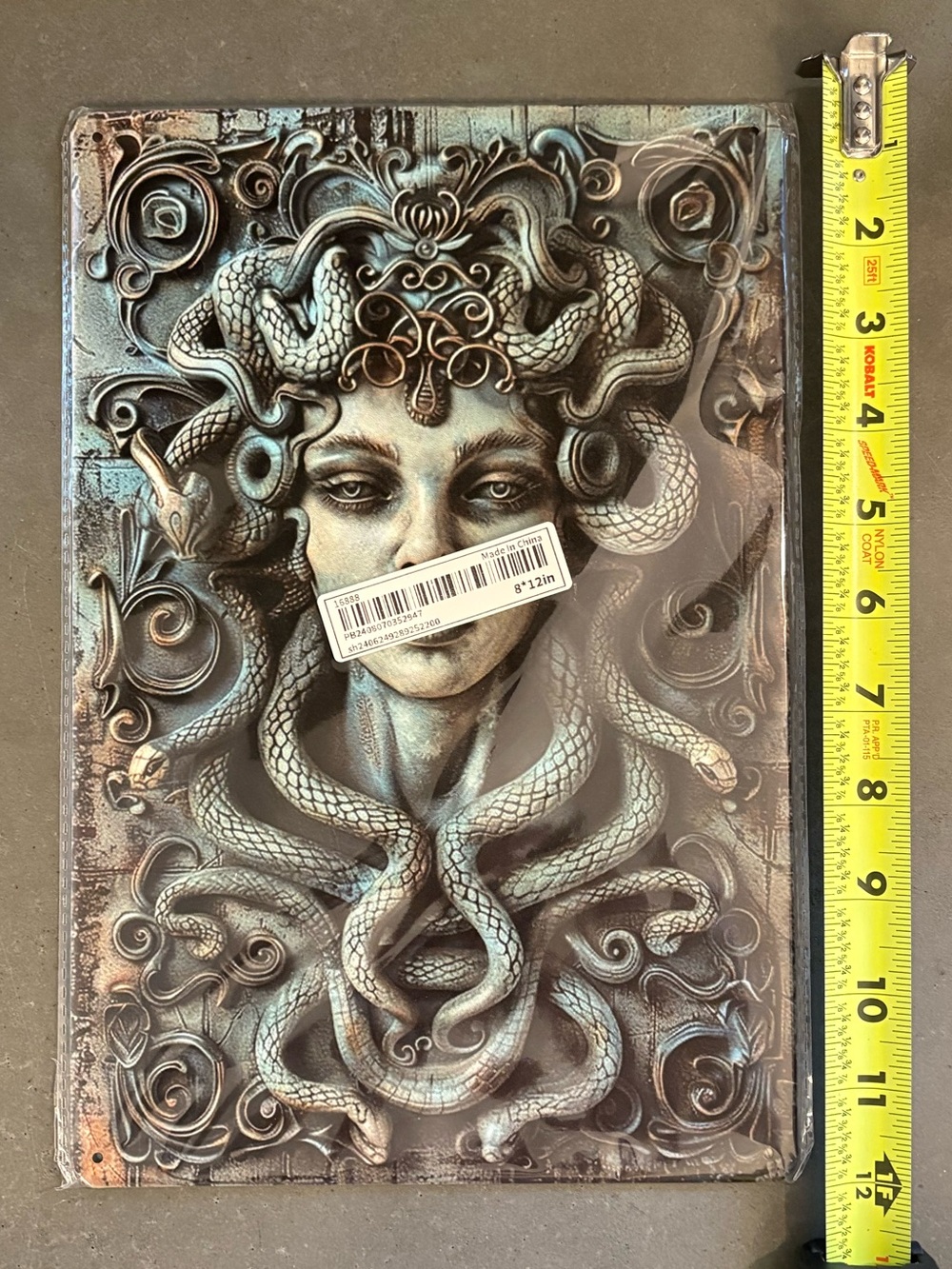 Medusa metal sign